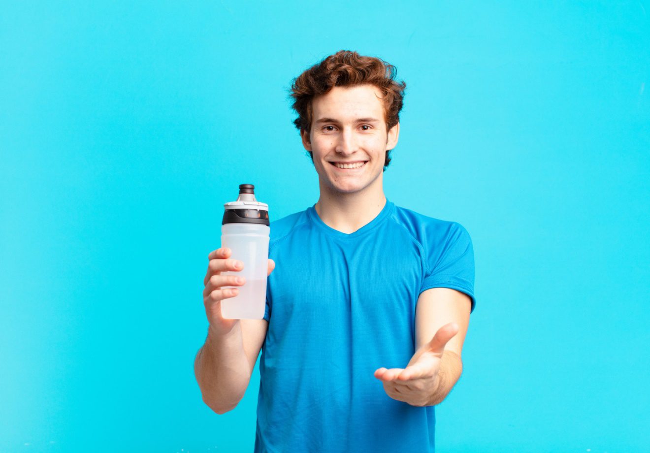 C:\Users\Dell\Downloads\sport-boy-smiling-happily-with-friendly-confident-positive-look-offering-showing-object-concept-energy-drink-concept.jpg