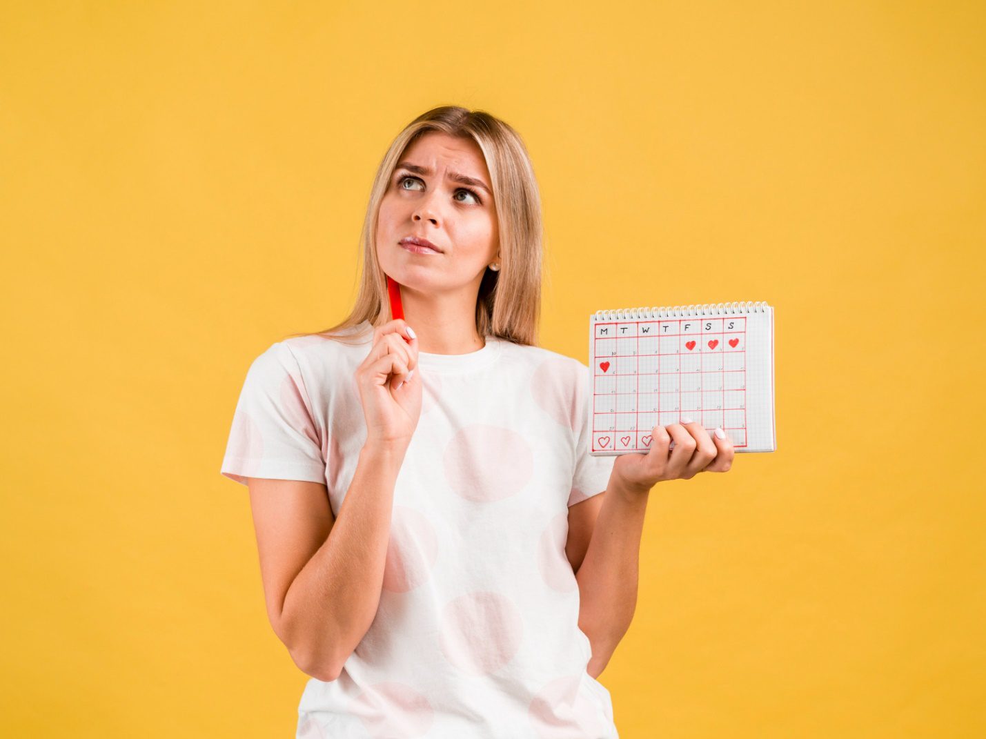 C:\Users\Dell\Downloads\medium-shot-woman-thinking-holding-period-calendar.jpg