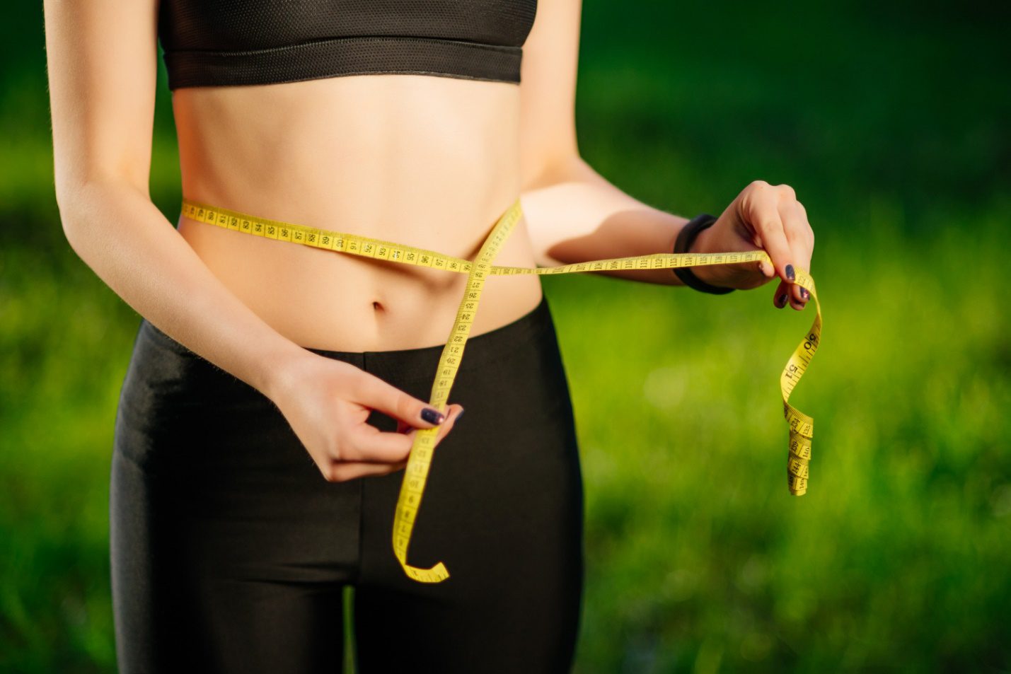 C:\Users\Dell\Downloads\young-woman-measuring-her-thin-waist-with-tape-measure.jpg